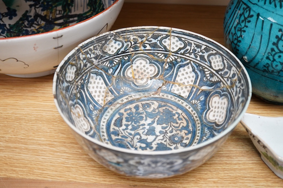 An early Persian pottery bowl and vase, a Japanese bowl and another Chinese segment dish, tallest 20cm